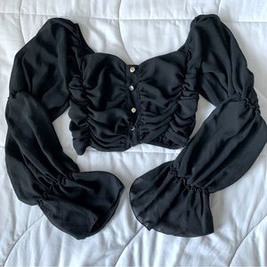 xs black cropped blouse with ruffled sleeves